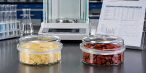 Sodium sulfide yellow flakes vs red flakes shown as sealed industrial samples for iron and quality comparison.